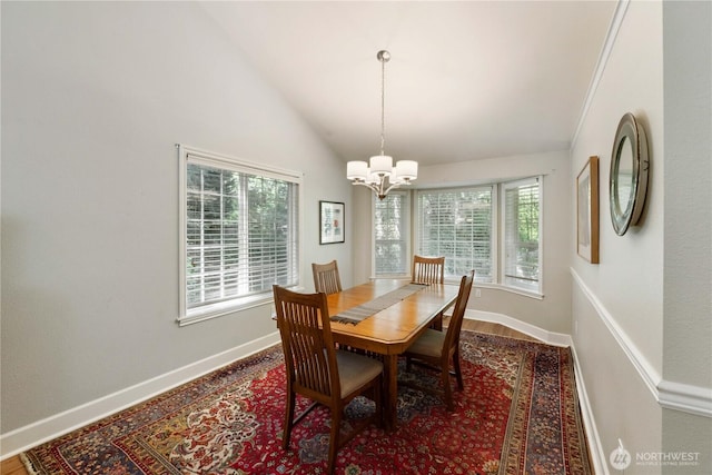 7829 197th Ave E, Bonney Lake, WA 98391 - dining area with a chandelier, high vaulted ceiling, and wood finished floors