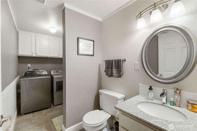 7829 197th Ave E, Bonney Lake, WA 98391 - bathroom featuring washing machine and clothes dryer, vanity, and ornamental molding