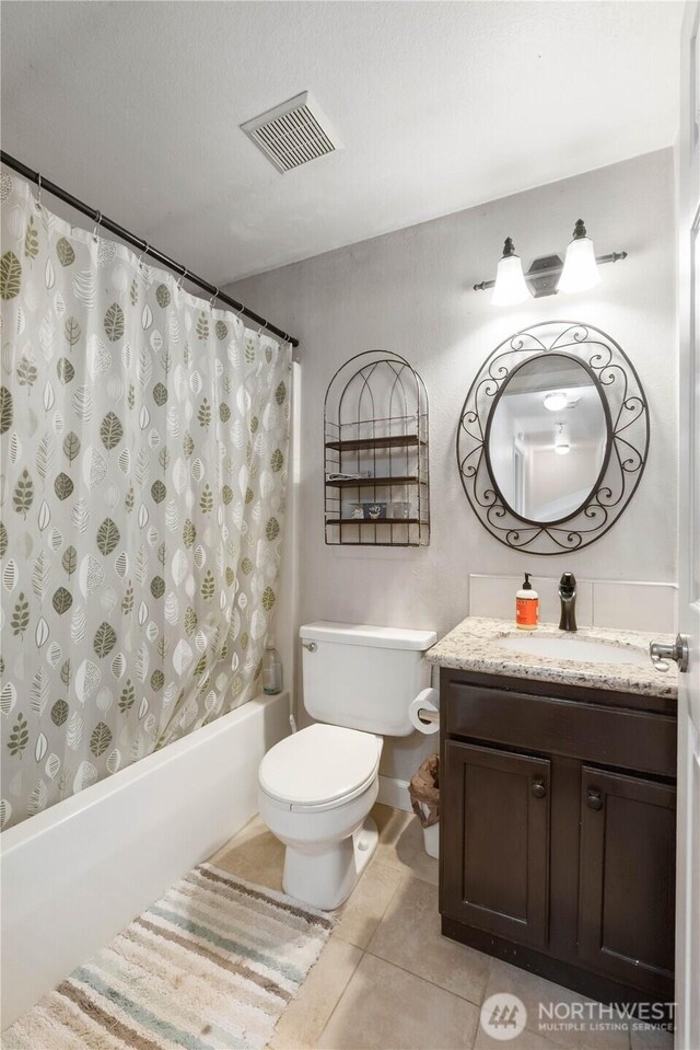 7829 197th Ave E, Bonney Lake, WA 98391 - bathroom featuring tile patterned floors, vanity, and shower / bath combination with curtain