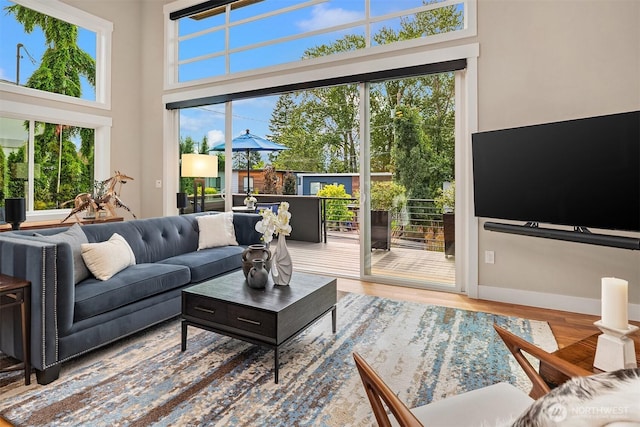 1808 2nd St, Kirkland, WA 98033 - living room with healthy amount of natural light, wood finished floors, and a high ceiling