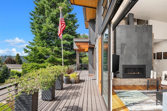 1808 2nd St, Kirkland, WA 98033 - wooden deck with a warm lit fireplace