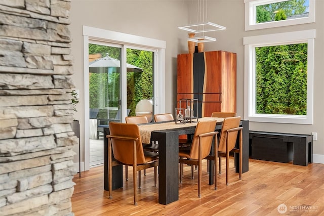 1808 2nd St, Kirkland, WA 98033 - dining area with a high ceiling, plenty of natural light, and light wood-style flooring