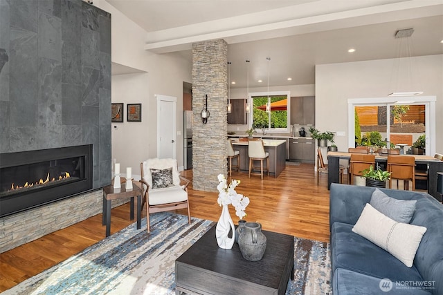 1808 2nd St, Kirkland, WA 98033 - living area with light wood-style flooring, a tiled fireplace, and recessed lighting