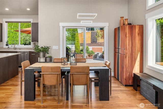 1808 2nd St, Kirkland, WA 98033 - dining room with light wood-style flooring, recessed lighting, and a high ceiling
