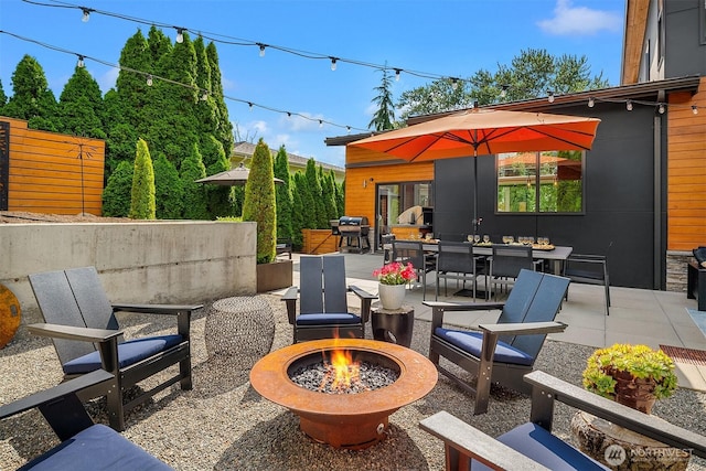 1808 2nd St, Kirkland, WA 98033 - view of patio / terrace featuring a fire pit, outdoor dining space, and a grill