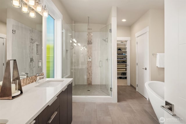 1808 2nd St, Kirkland, WA 98033 - bathroom featuring a stall shower, a walk in closet, vanity, and a freestanding bath