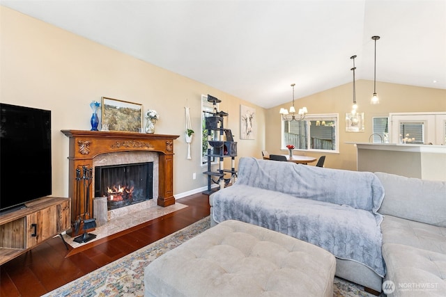 4201 SW 328th Ct, Federal Way, WA 98023 - living area featuring wood finished floors, vaulted ceiling, a chandelier, and a fireplace
