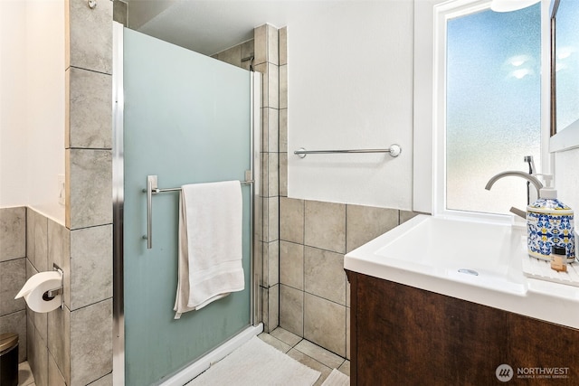4201 SW 328th Ct, Federal Way, WA 98023 - bathroom featuring tile walls, a shower stall, vanity, and tile patterned floors