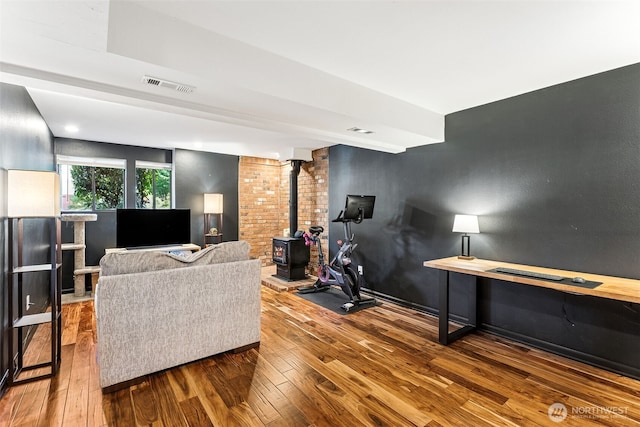 4201 SW 328th Ct, Federal Way, WA 98023 - living area featuring wood-type flooring, a wood stove, and recessed lighting