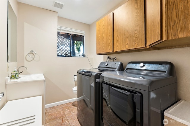 4201 SW 328th Ct, Federal Way, WA 98023 - washroom with washing machine and clothes dryer and light stone finish floors