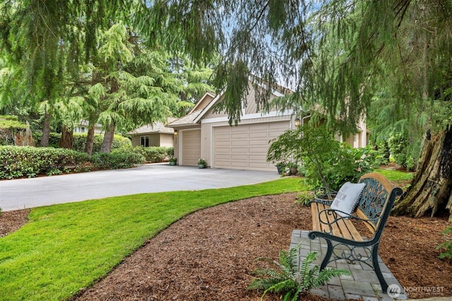 8834 Goldeneye Ln, Blaine, WA 98230 - view of green lawn featuring driveway and an attached garage