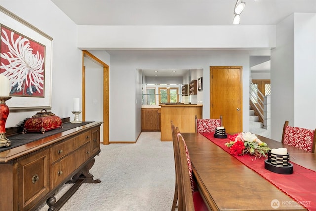 8834 Goldeneye Ln, Blaine, WA 98230 - dining space with light colored carpet and stairway