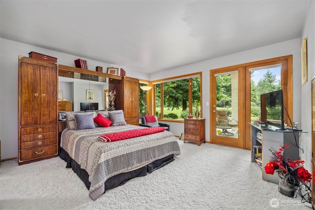 8834 Goldeneye Ln, Blaine, WA 98230 - bedroom with light carpet and access to outside