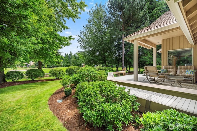 8834 Goldeneye Ln, Blaine, WA 98230 - view of green lawn with a wooden deck and view of scattered trees