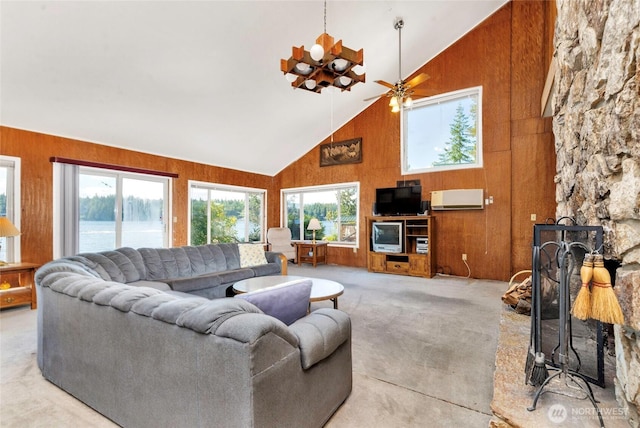 1171 E Mason Lake Dr E, Grapeview, WA 98546 - living room with high vaulted ceiling, plenty of natural light, wood walls, and light colored carpet