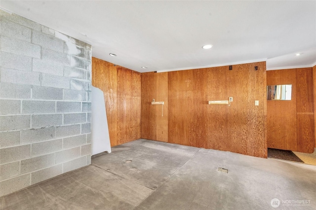 1171 E Mason Lake Dr E, Grapeview, WA 98546 - empty room featuring recessed lighting, wood walls, and concrete flooring