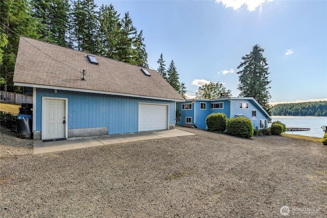 1171 E Mason Lake Dr E, Grapeview, WA 98546 - detached garage featuring a water view