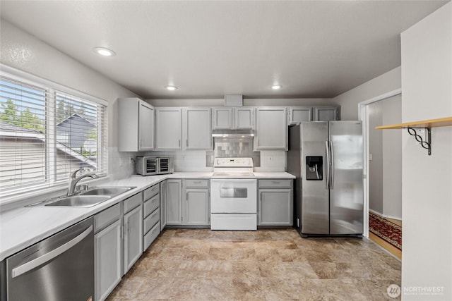 742 N 103rd St, Seattle, WA 98133 - kitchen featuring stainless steel appliances, gray cabinetry, light countertops, and recessed lighting