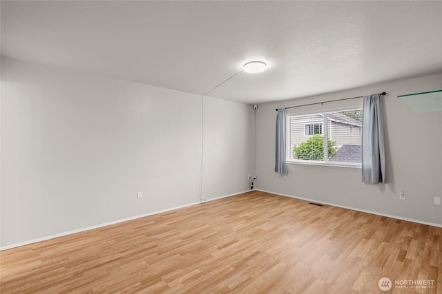 742 N 103rd St, Seattle, WA 98133 - unfurnished room with light wood-style floors and baseboards