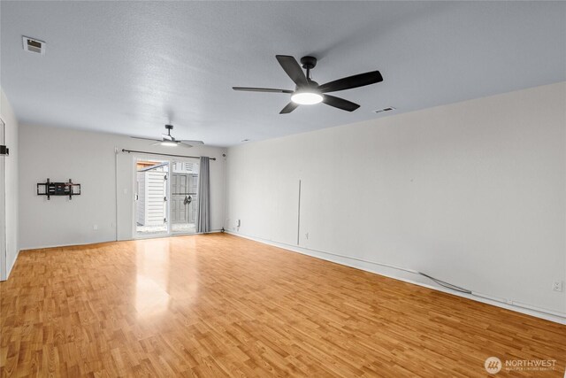 742 N 103rd St, Seattle, WA 98133 - unfurnished room featuring light wood-style floors and a ceiling fan