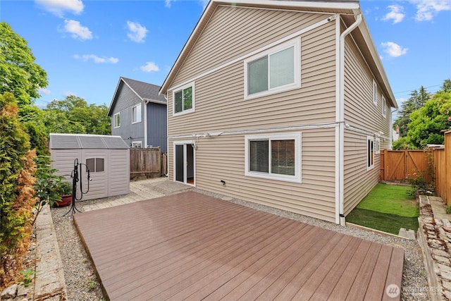 742 N 103rd St, Seattle, WA 98133 - wooden terrace with a storage unit and a fenced backyard