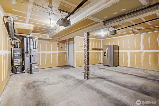 742 N 103rd St, Seattle, WA 98133 - garage featuring stainless steel refrigerator with ice dispenser, water heater, a garage door opener, and heating unit