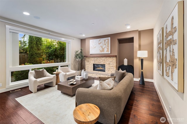 17477 NE 123rd Way, Redmond, WA 98052 - living area featuring dark wood-type flooring, a stone fireplace, and recessed lighting