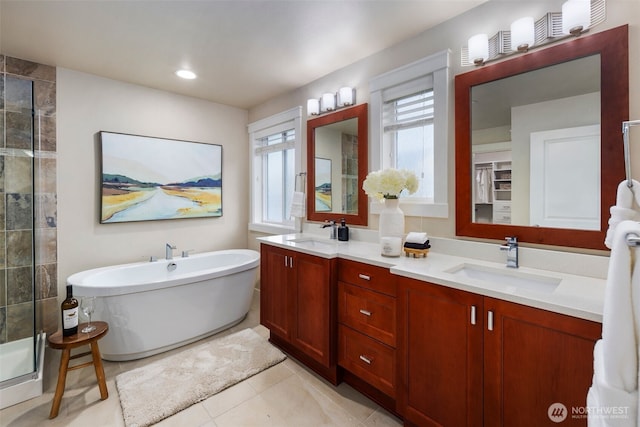 17477 NE 123rd Way, Redmond, WA 98052 - full bath featuring a freestanding tub, a tile shower, double vanity, and tile patterned flooring