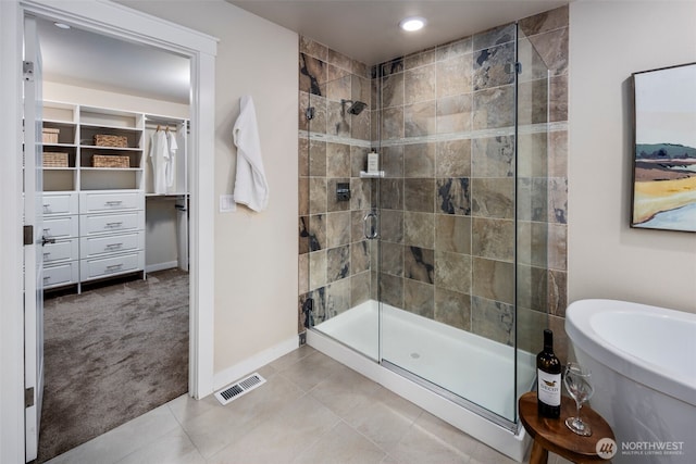 17477 NE 123rd Way, Redmond, WA 98052 - full bath with a shower stall, a walk in closet, tile patterned flooring, and recessed lighting