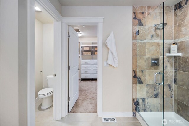 17477 NE 123rd Way, Redmond, WA 98052 - full bathroom featuring a shower stall, tile patterned floors, and a spacious closet