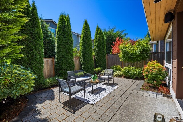 17477 NE 123rd Way, Redmond, WA 98052 - fenced backyard with a patio area and an outdoor living space
