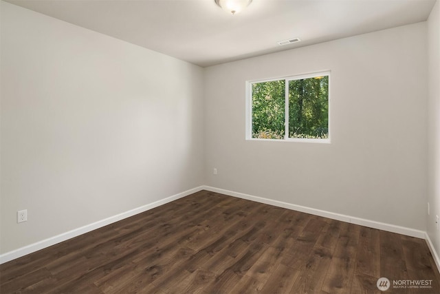 12611 37th Pl NE, Lake Stevens, WA 98258 - spare room featuring baseboards and dark wood-type flooring
