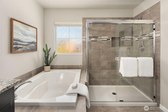 12611 37th Pl NE, Lake Stevens, WA 98258 - full bath with a stall shower, a garden tub, vanity, and tile patterned flooring