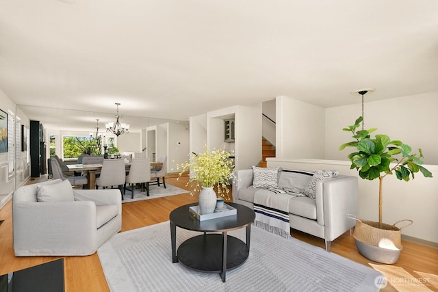 2218 N 38th St, Seattle, WA 98103 - living room featuring wood finished floors, a chandelier, and stairway