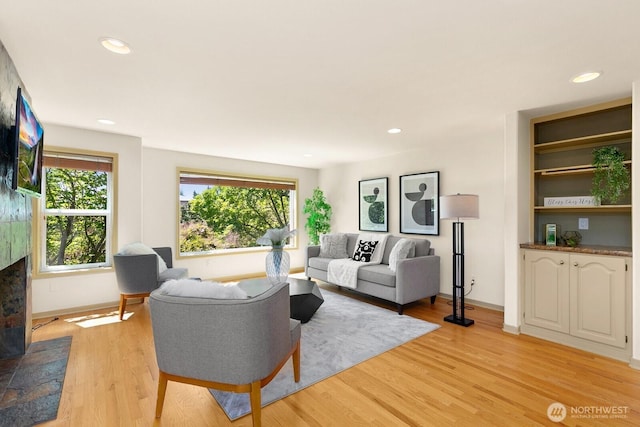 2218 N 38th St, Seattle, WA 98103 - living room featuring light wood-style flooring, a fireplace, and recessed lighting