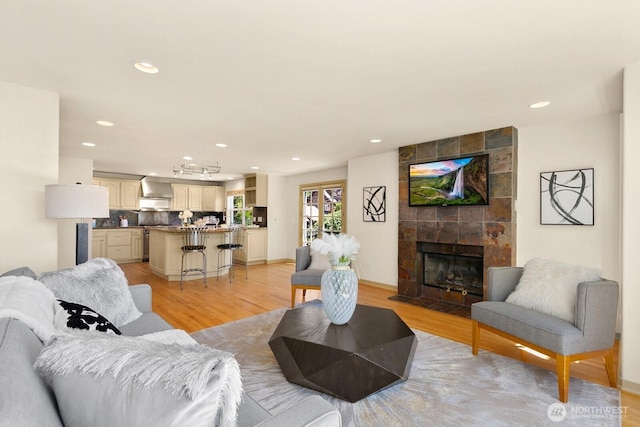 2218 N 38th St, Seattle, WA 98103 - living area with light wood-style flooring, recessed lighting, and a fireplace