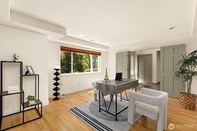2218 N 38th St, Seattle, WA 98103 - home office with light wood-style flooring, a tray ceiling, and recessed lighting