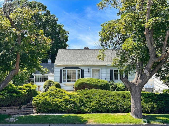 304 Columbia Ave, Coulee Dam, WA 99116 - cape cod home featuring a chimney and roof with shingles