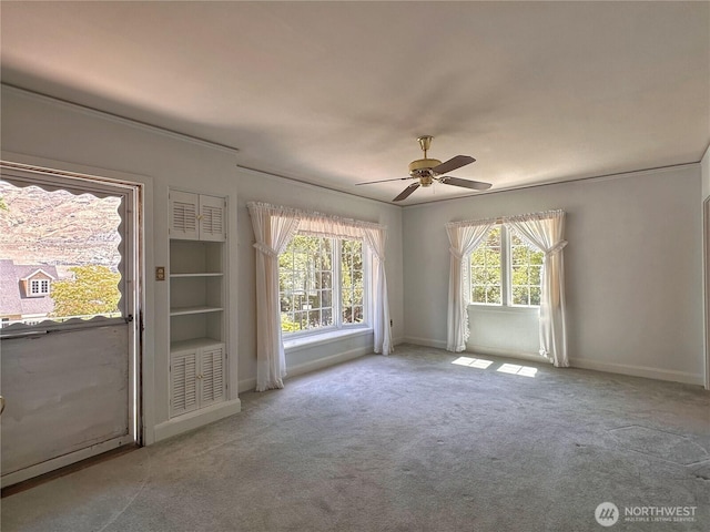 304 Columbia Ave, Coulee Dam, WA 99116 - carpeted spare room with a ceiling fan and crown molding