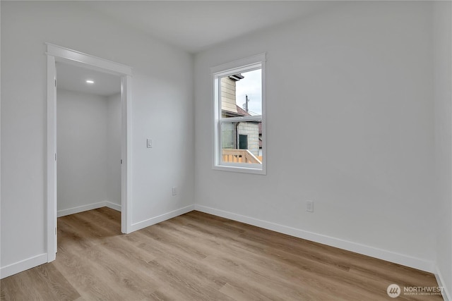 1215 N 10th St, Tacoma, WA 98403 - empty room with light wood-type flooring and baseboards