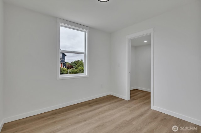 1215 N 10th St, Tacoma, WA 98403 - spare room with plenty of natural light and light wood finished floors