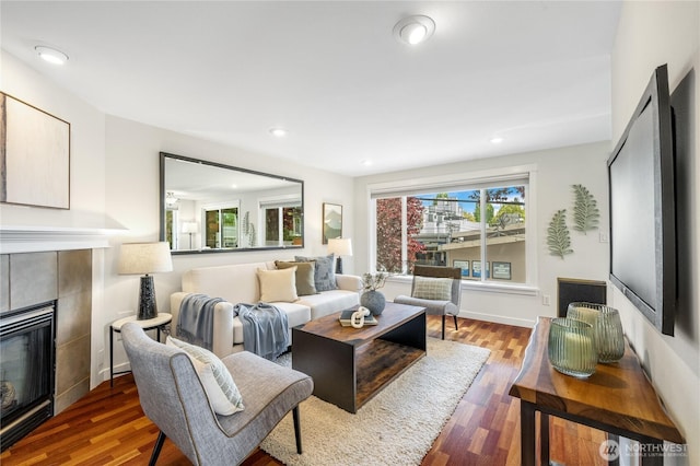 2344 44th Ave SW Unit B, Seattle, WA 98116 - living room featuring a tile fireplace, wood finished floors, and recessed lighting