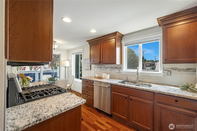 2344 44th Ave SW Unit B, Seattle, WA 98116 - kitchen with dishwasher, light wood finished floors, backsplash, healthy amount of natural light, and recessed lighting