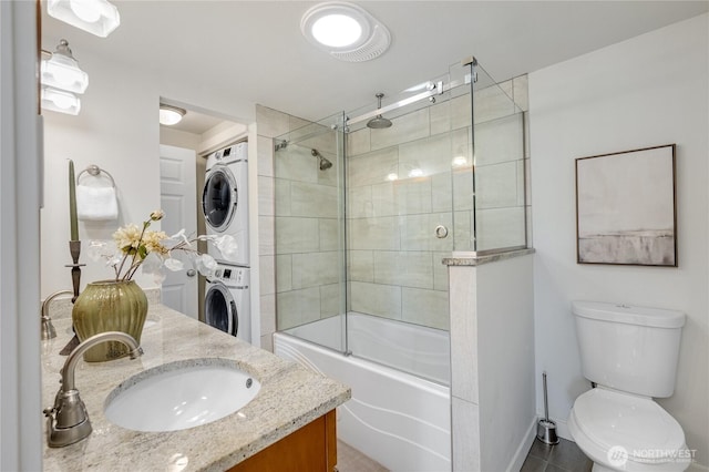 2344 44th Ave SW Unit B, Seattle, WA 98116 - bathroom featuring stacked washer / dryer, vanity, a combined bath / shower with rainfall shower, and tile patterned floors