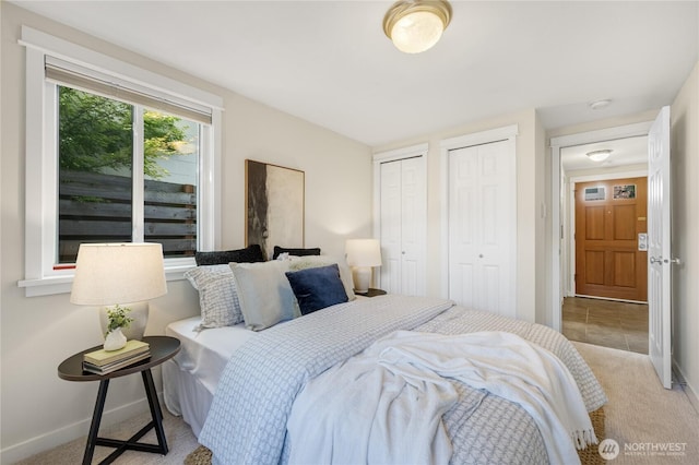 2344 44th Ave SW Unit B, Seattle, WA 98116 - carpeted bedroom with multiple closets and baseboards