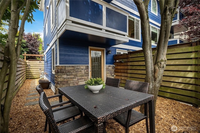 2344 44th Ave SW Unit B, Seattle, WA 98116 - fenced backyard featuring outdoor dining area