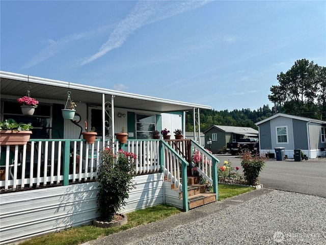 5626 SW 113th Ave E Unit 63, Puyallup, WA 98372 - manufactured / mobile home with covered porch