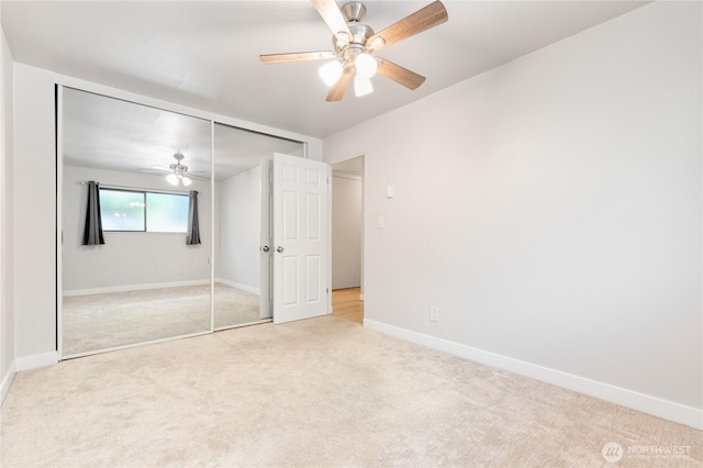 5101 NE 55th St Unit 103, Seattle, WA 98105 - unfurnished bedroom featuring light carpet, a closet, and a ceiling fan