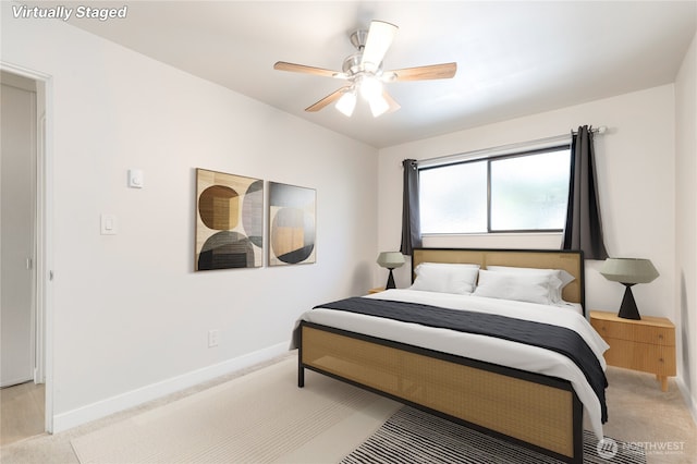 5101 NE 55th St Unit 103, Seattle, WA 98105 - bedroom with light carpet and a ceiling fan