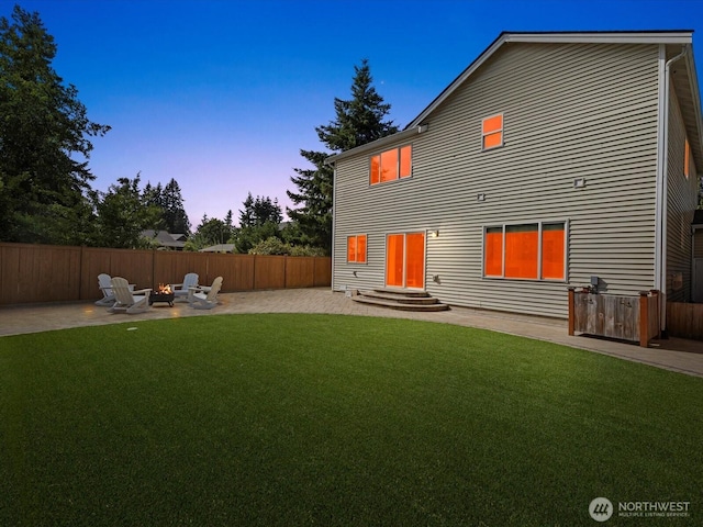 11040 22nd Pl NE, Lake Stevens, WA 98258 - back of house at dusk featuring a patio, an outdoor fire pit, and entry steps